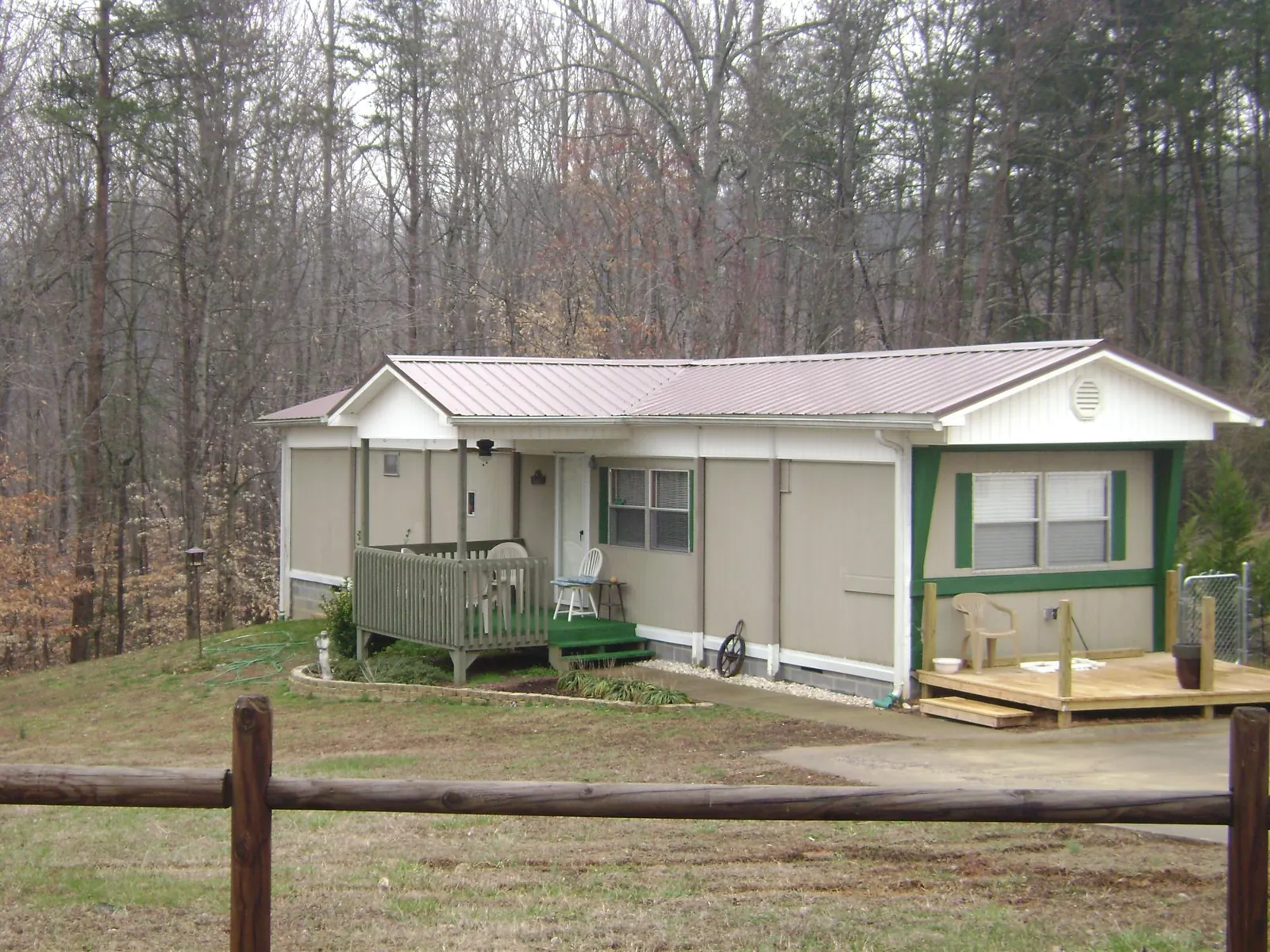 Mauve metal roof on a manufactured home with a new front deck in Schaumburg